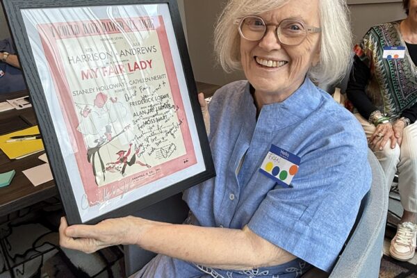 Fran Collmann is honored for her service at the Conspirare Board Retreat with the customary "I Could Have Danced All Night" sheet music with a personal message from Craig Hella Johnson.